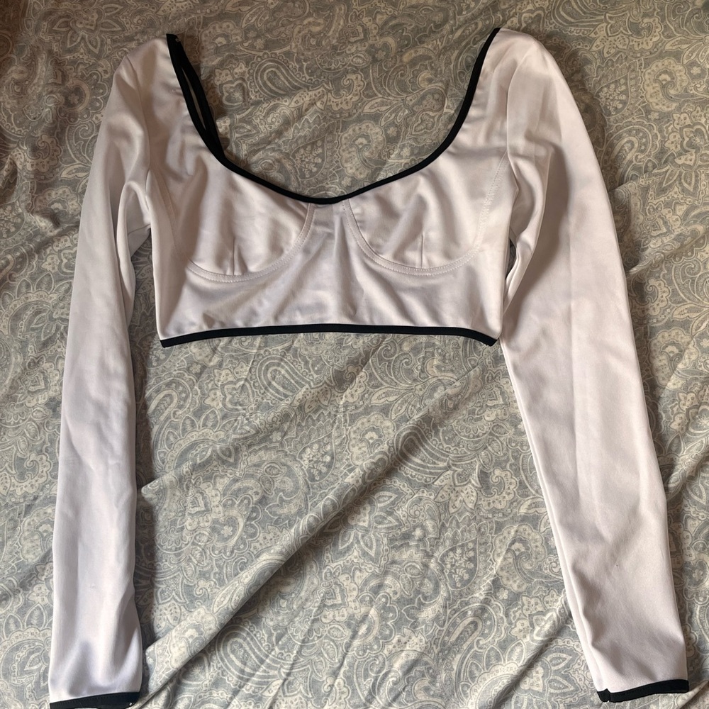 White and black long sleeve crop top.